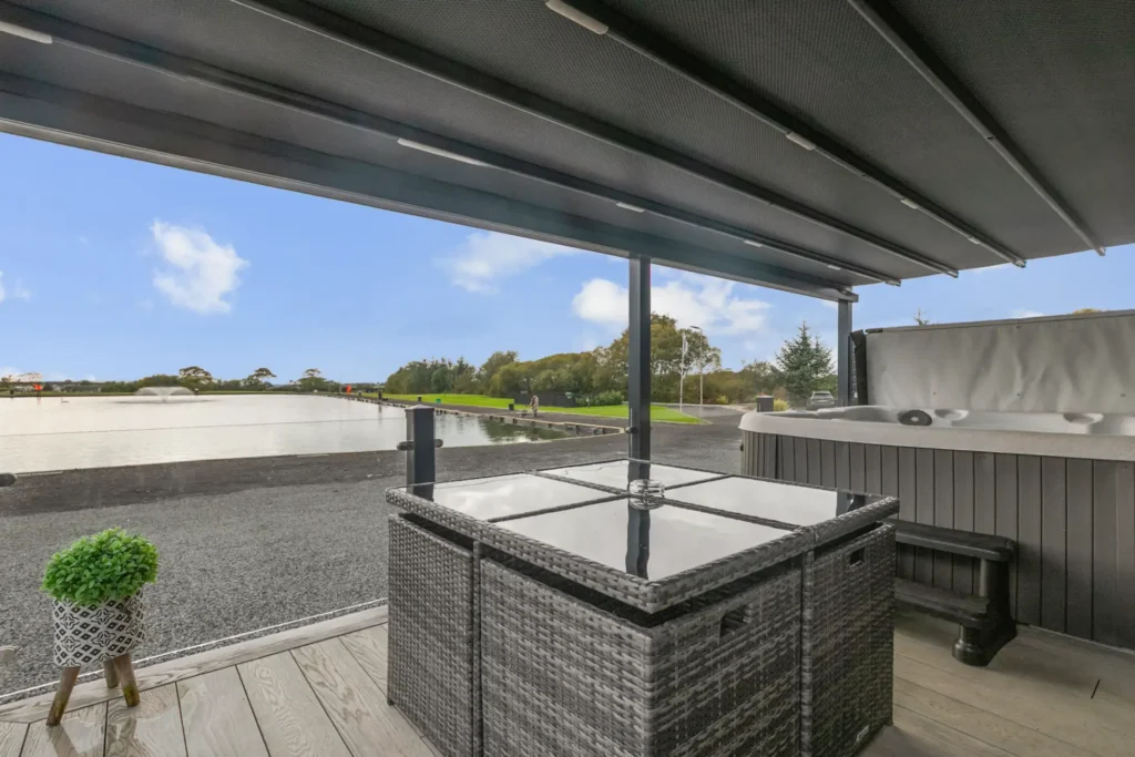 Private deck at Twin Lodge 5 with hot tub and outdoor seating