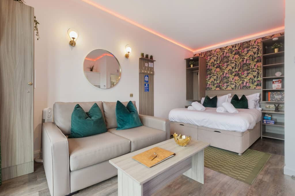 Interior of Pod 6 with double bed and seating area