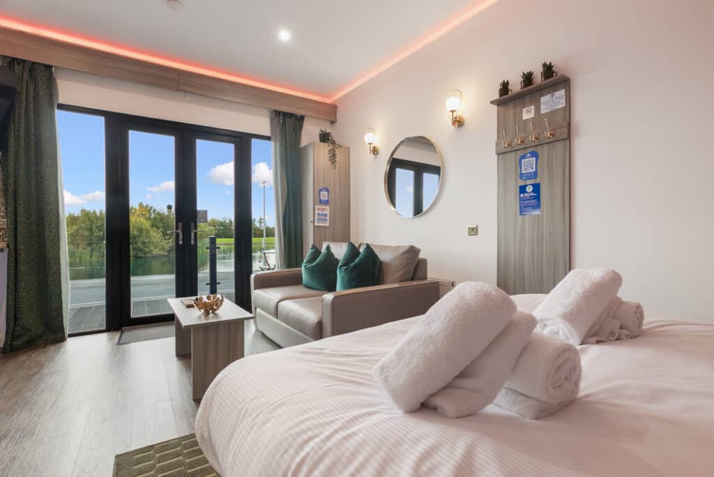 Double bed in Pod 6 with towels laid out