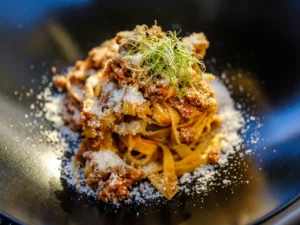 Tagliatelle with ragu and grated parmesan
