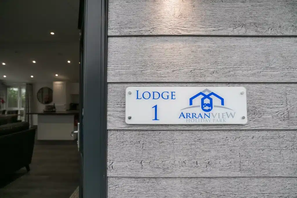 Exterior nameplate at Twin Lodge 1 reading Lodge 1 Arranview