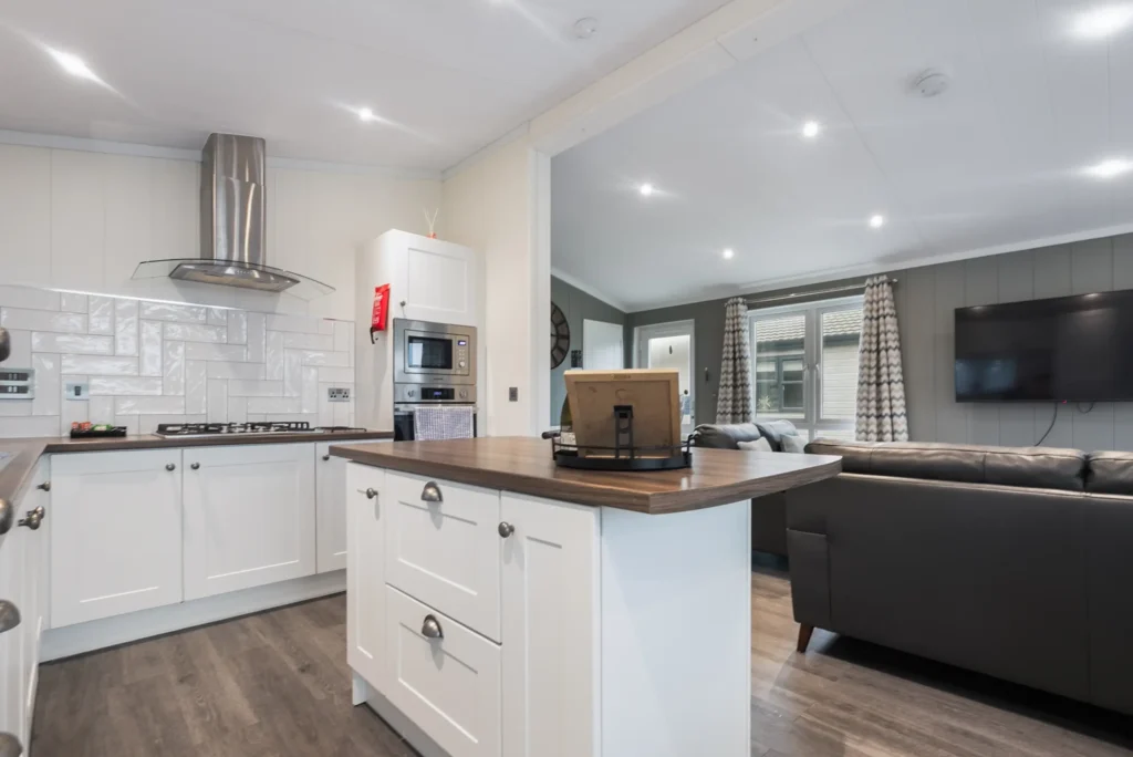 Kitchen island in Twin Lodge 1 with wall-mounted TV